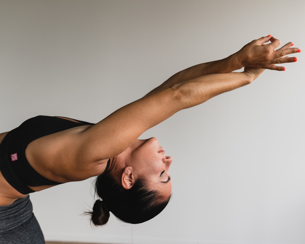 Woman performing stretching exercises for pain relief